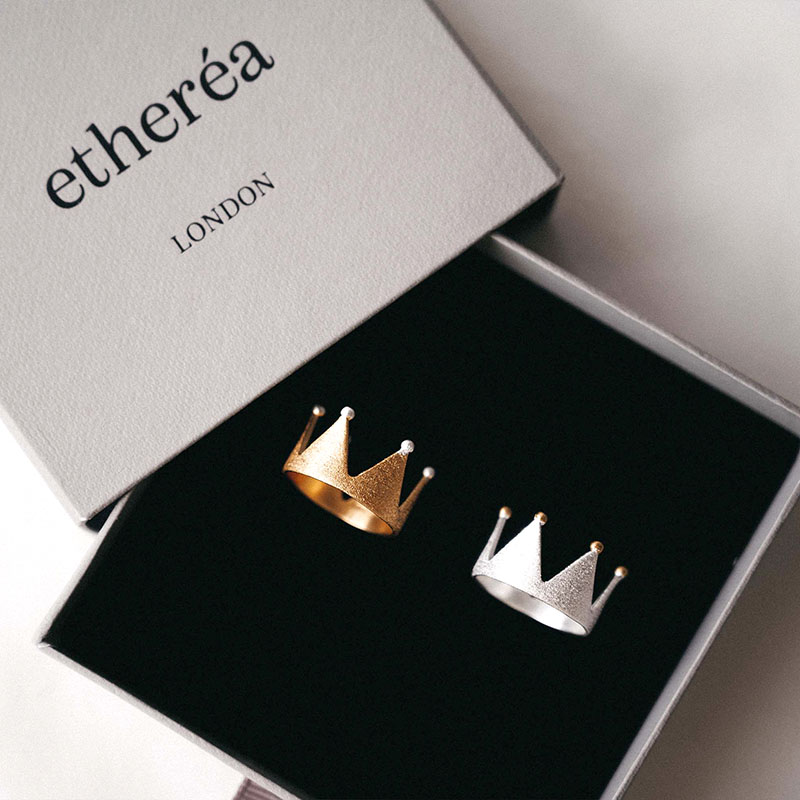 An image of Etherea branded jewellery box with two rings in it